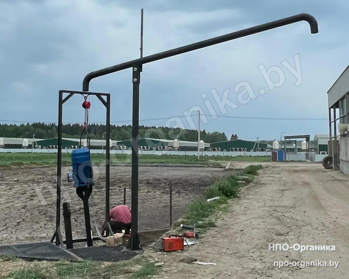 A discharge gooseneck on a post, a pump on a hoist in a portal, installation on site